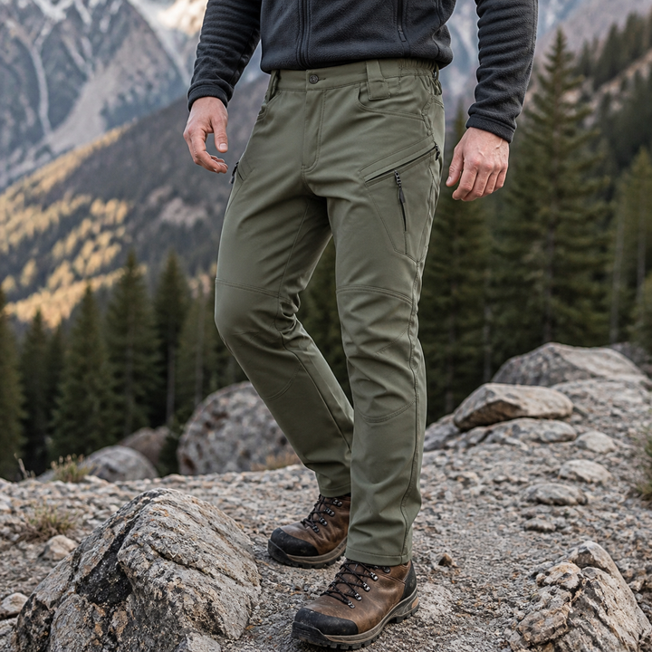 Army Green fleece-lined hiking pants on an autumn mountain trail
